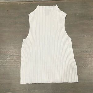 Woman’s sleeveless mock turtleneck in white size medium.